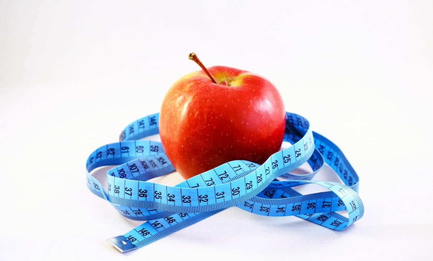 manzana y cinta m&eacute;trica / dietas