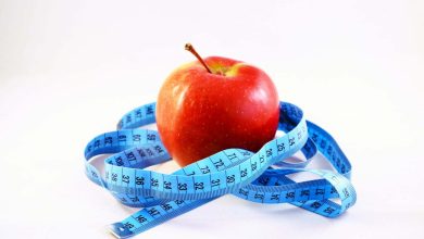 manzana y cinta m&eacute;trica / dietas